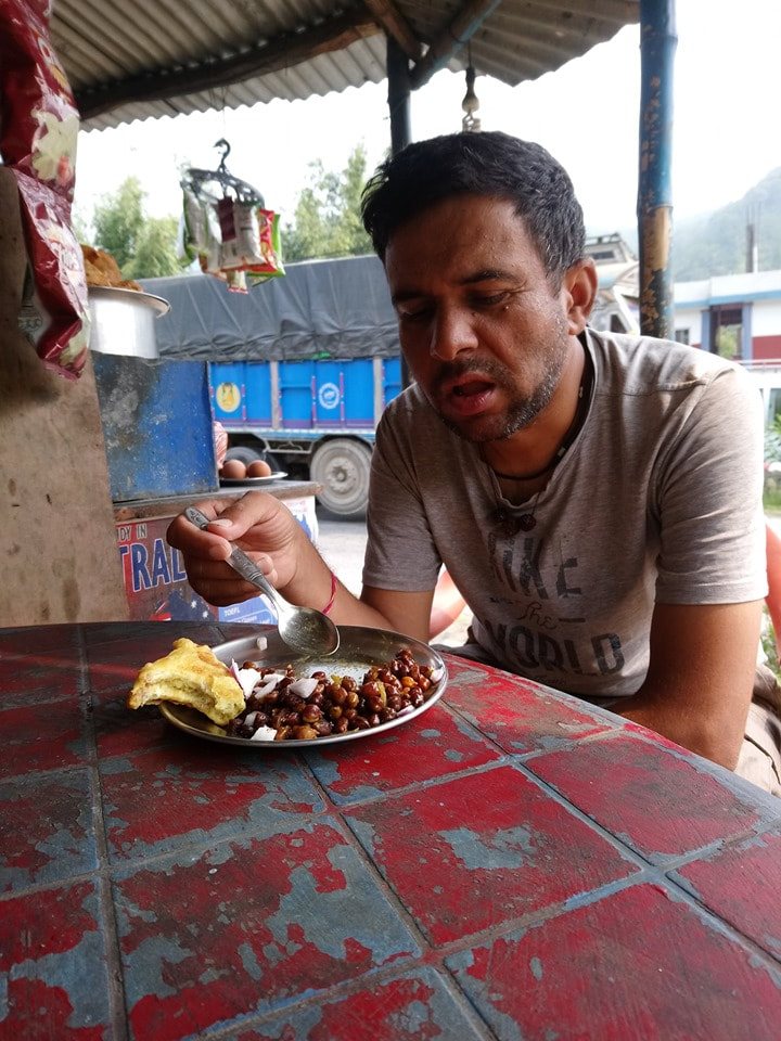 Bhakti having his mid morning snack at a local street side stall.
With Bhakti Devkota.
